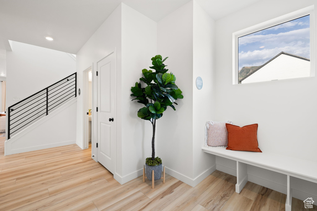 Hallway with light wood-type flooring