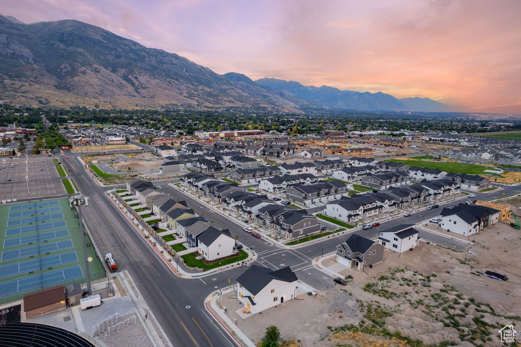 Aerial view at dusk featuring a mountain view