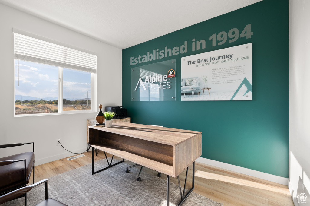 Home office featuring wood-type flooring