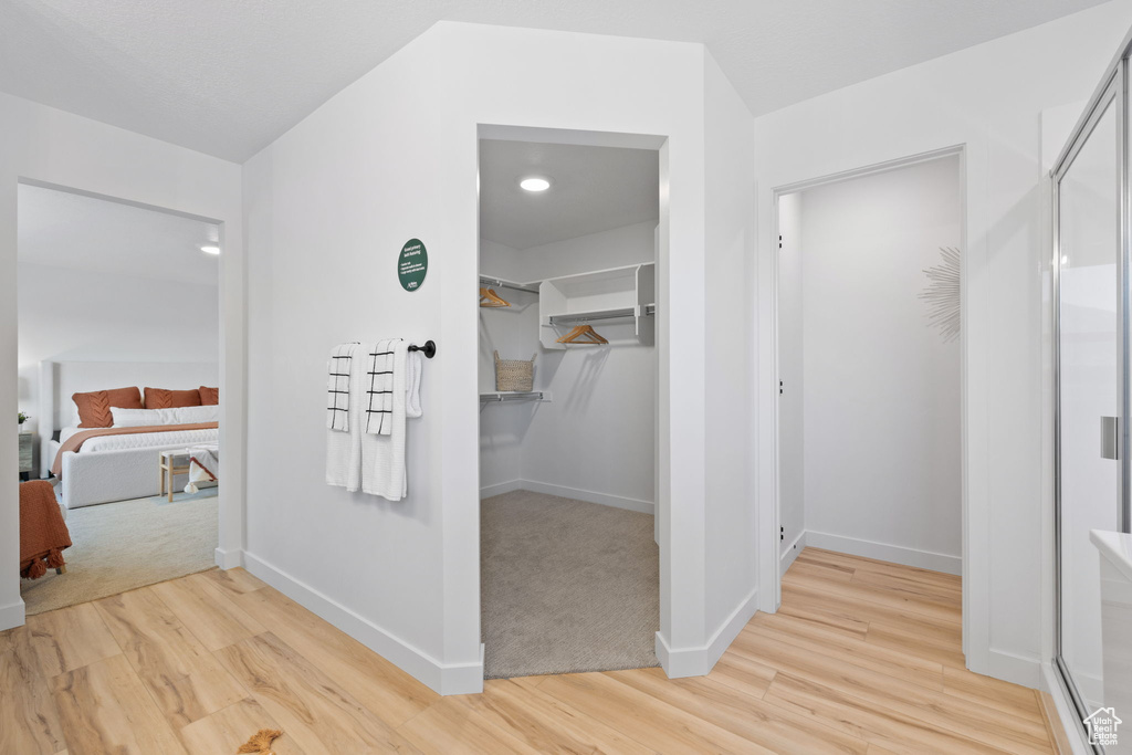 Corridor featuring light hardwood / wood-style floors