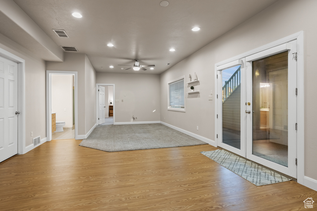 Interior space featuring light wood-type flooring and ceiling fan