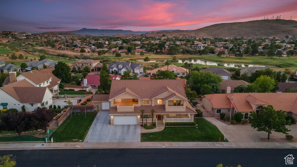 Aerial view at dusk with a water and mountain view