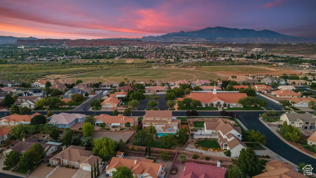 Aerial view at dusk featuring a mountain view