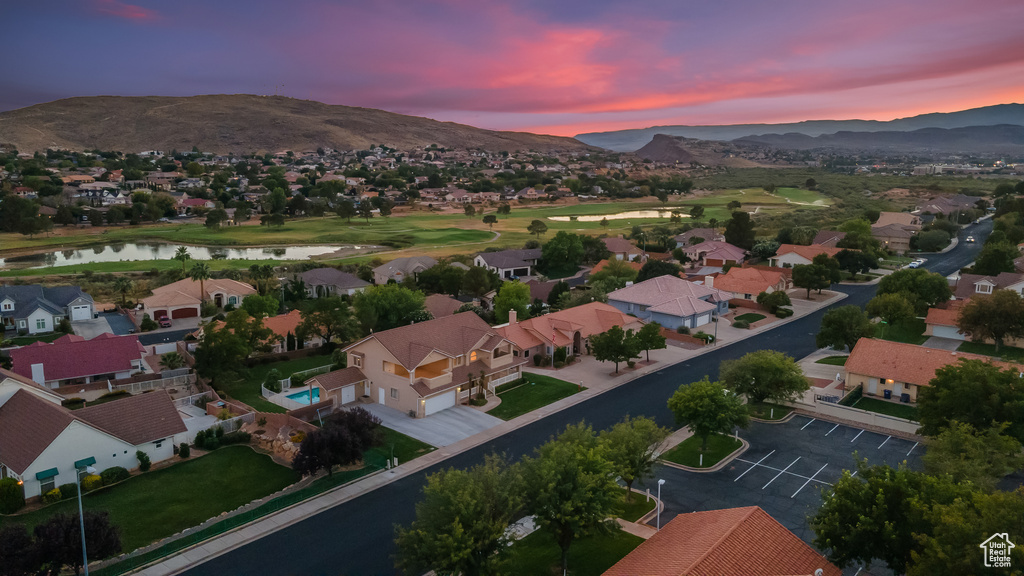 Aerial view at dusk with a water and mountain view