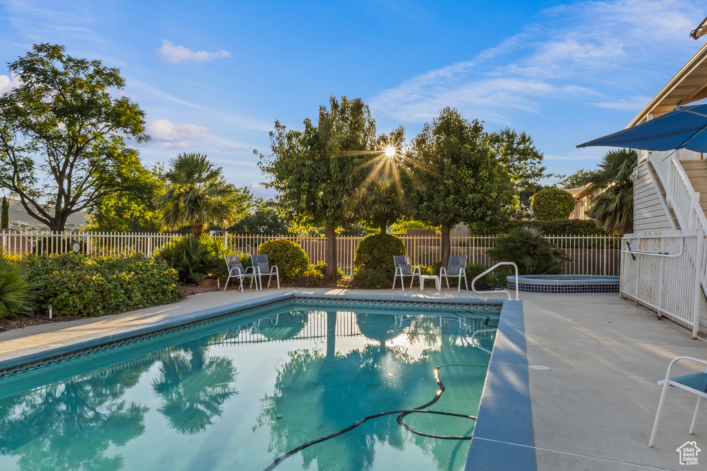 View of swimming pool featuring a patio