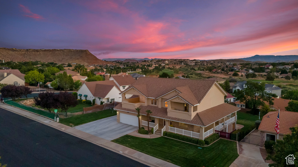 Aerial view at dusk featuring a mountain view