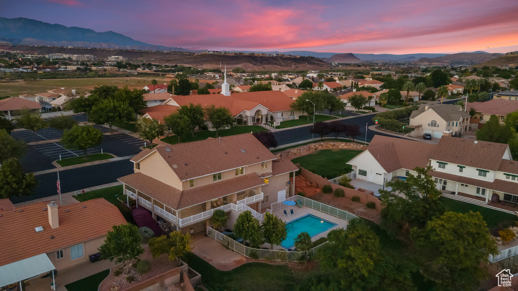 Aerial view at dusk featuring a mountain view