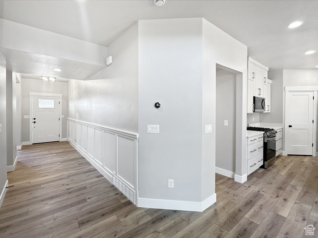 Hall featuring light hardwood / wood-style floors