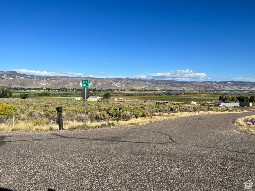 Property view of mountains with a rural view