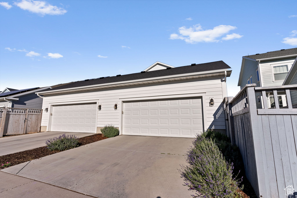 Garage featuring wooden walls