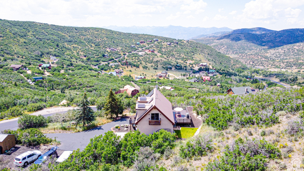 Birds eye view of property with a mountain view