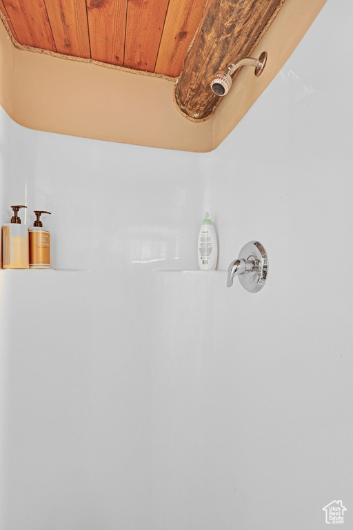 Details with a shower and wood ceiling