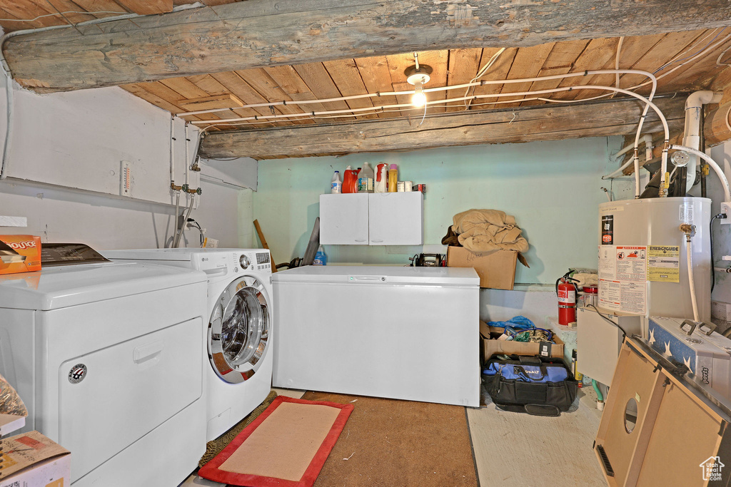 Clothes washing area with water heater and independent washer and dryer