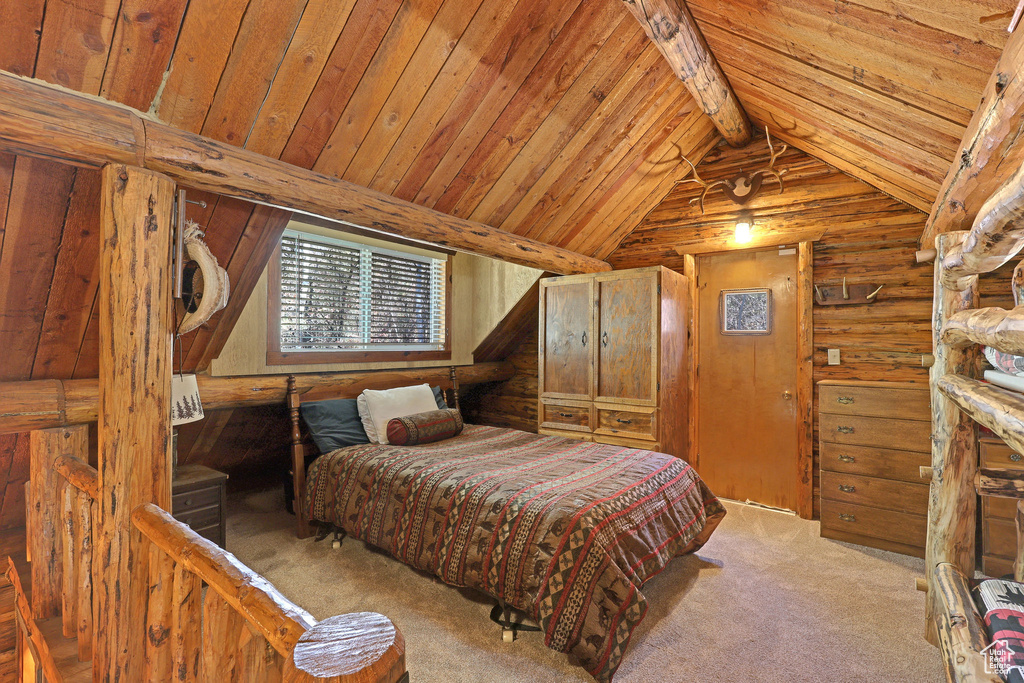 Carpeted bedroom featuring wooden walls, wood ceiling, and lofted ceiling with beams