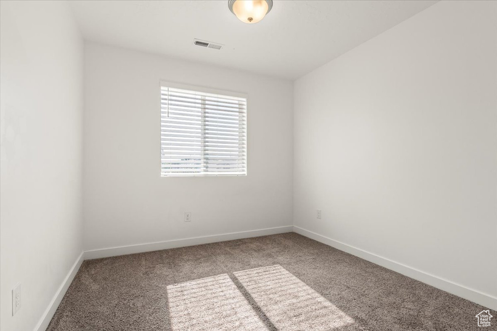 Empty room featuring carpet