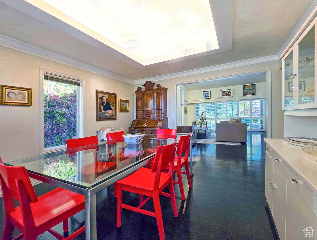 Dining room featuring plenty of natural light and ornamental molding