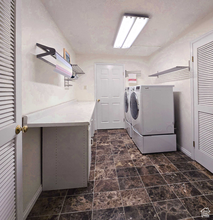 Laundry area featuring washing machine and clothes dryer