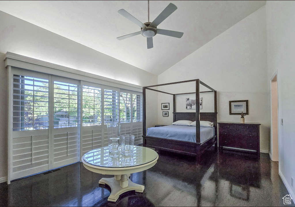 Bedroom featuring high vaulted ceiling and ceiling fan