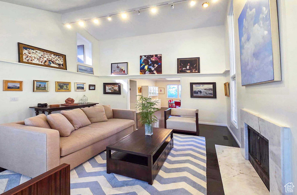 Living room with a fireplace and track lighting