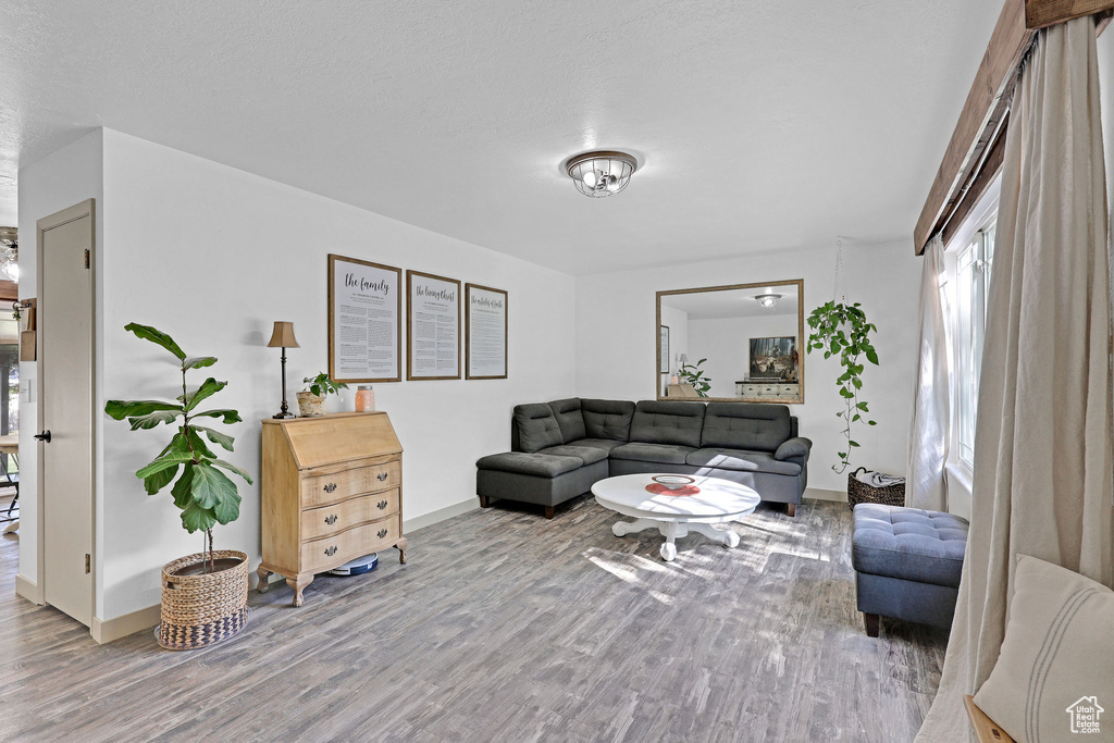 Living room with hardwood / wood-style flooring