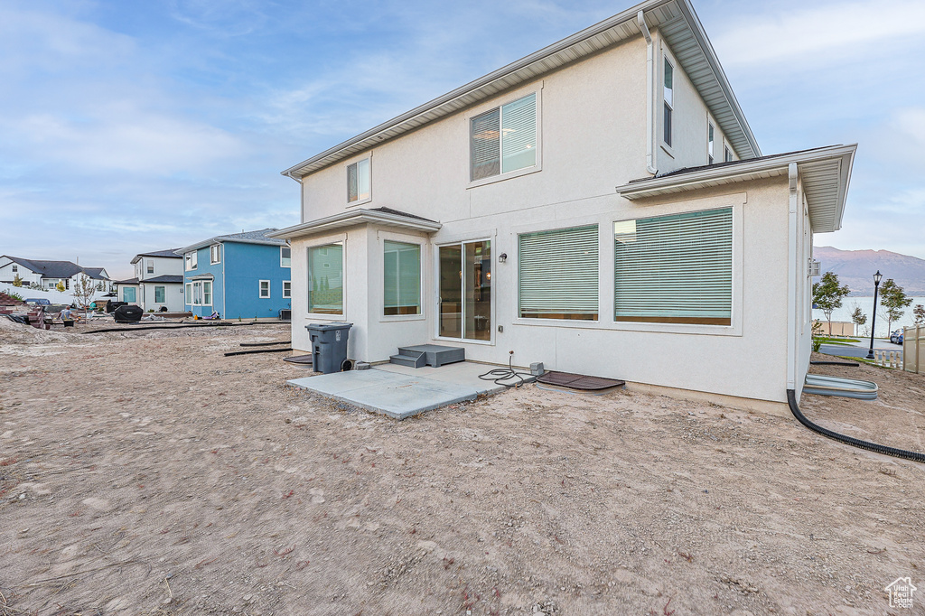 Rear view of house featuring a patio area