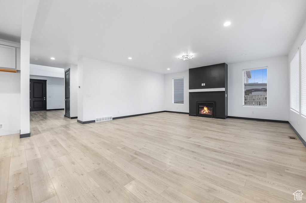 Unfurnished living room featuring light hardwood / wood-style flooring