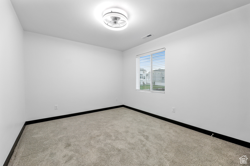 View of carpeted spare room