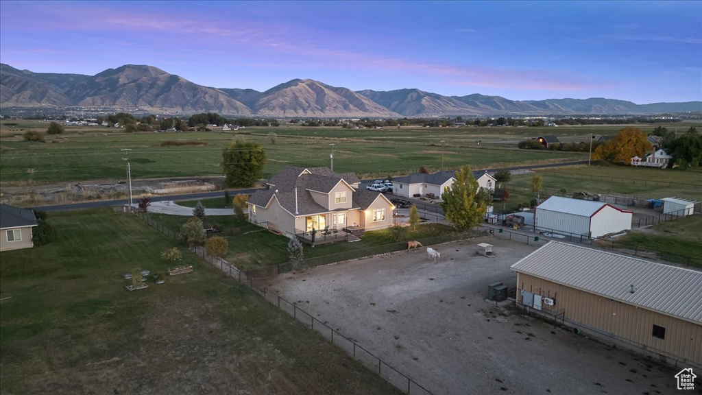 Aerial view at dusk featuring a mountain view