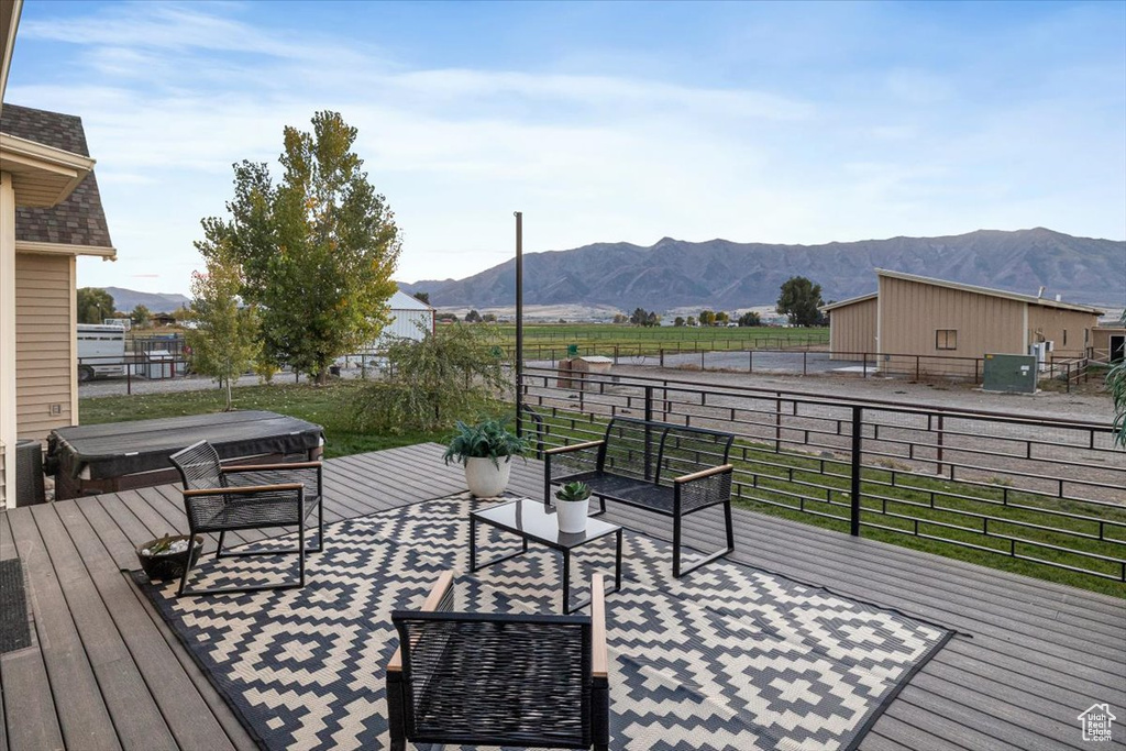 Wooden deck featuring a mountain view