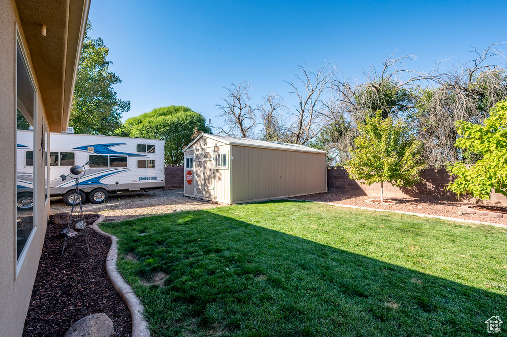 View of yard featuring a storage unit