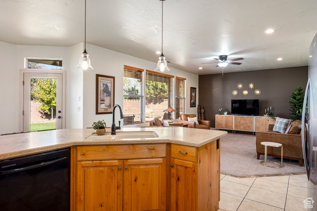 Kitchen with a wealth of natural light, dishwasher, decorative light fixtures, and sink