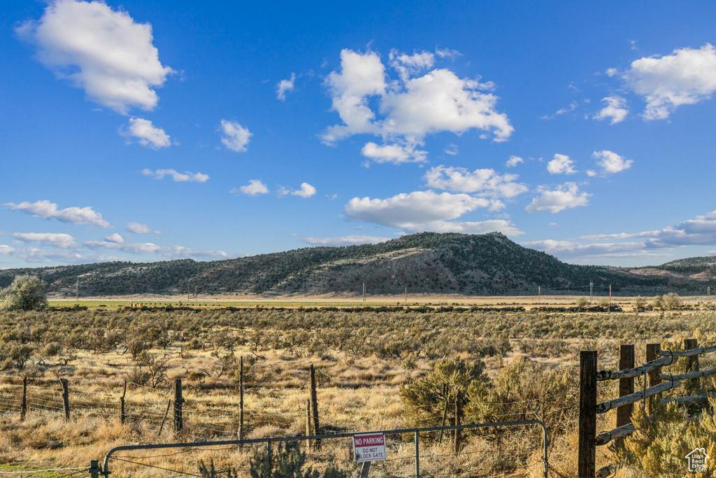 Property view of mountains with a rural view