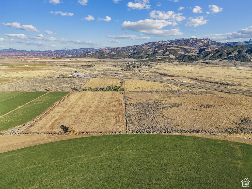 Birds eye view of property with a mountain view and a rural view