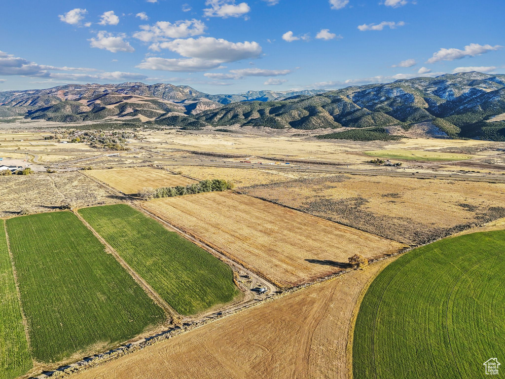 Aerial view featuring a rural view and a mountain view