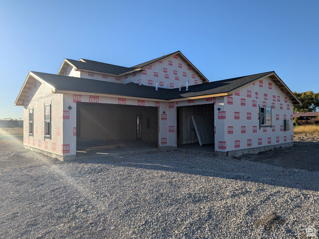 View of side of property featuring a garage