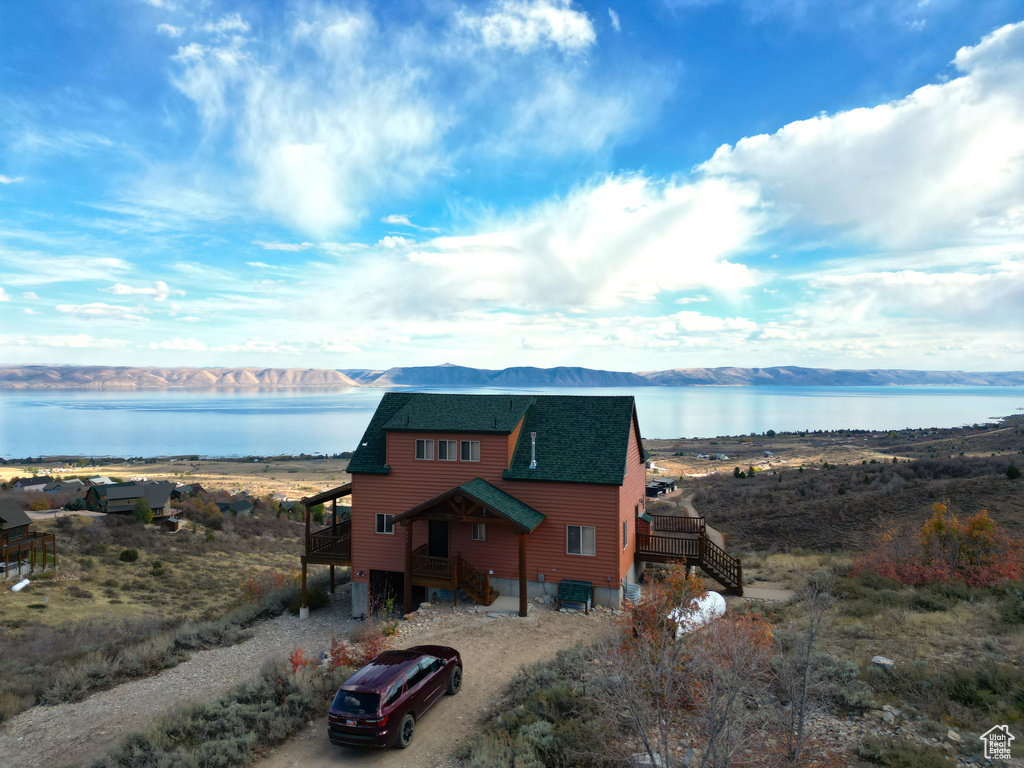 Exterior space featuring a water and mountain view