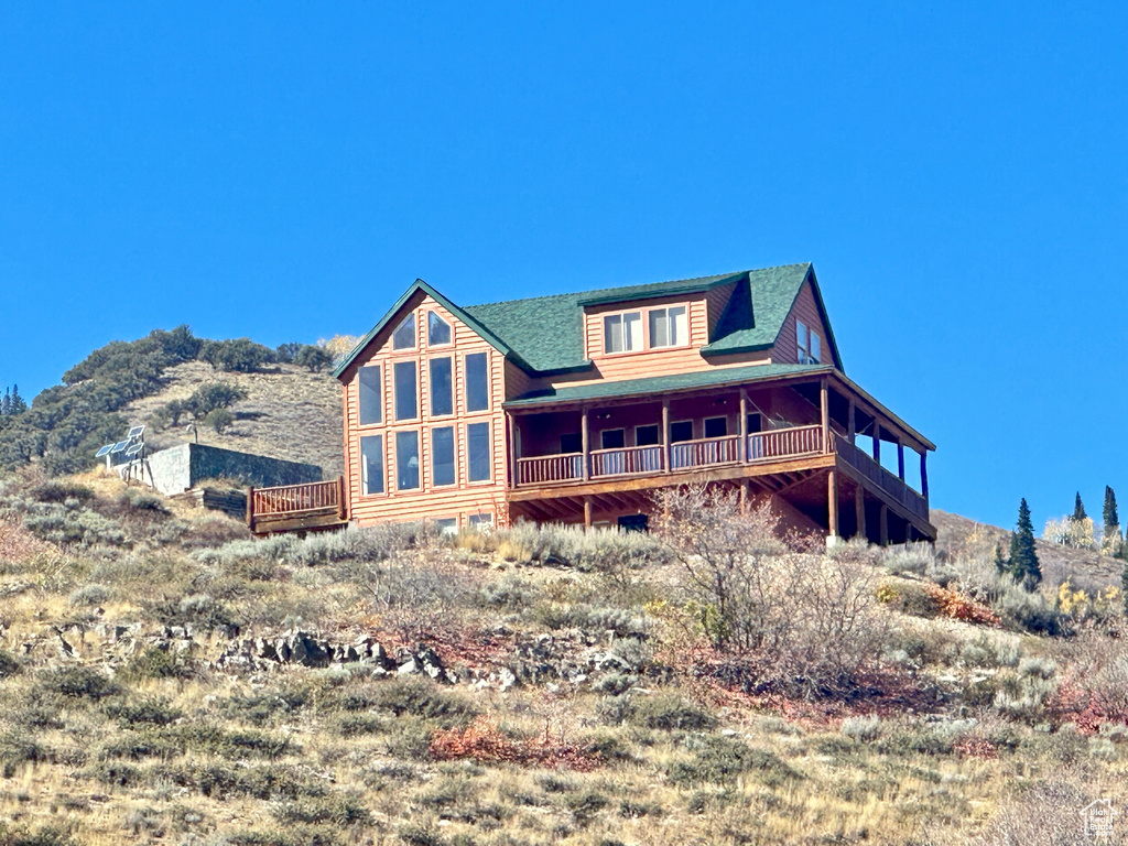 Back of house featuring a wooden deck