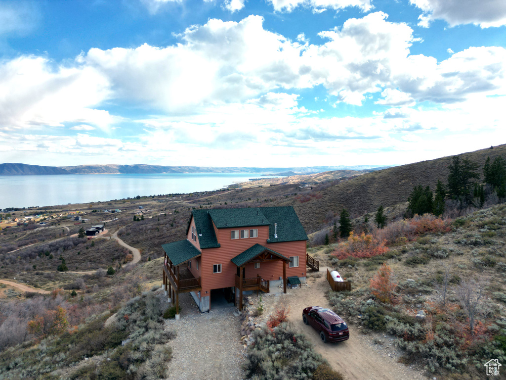 Drone / aerial view with a water and mountain view