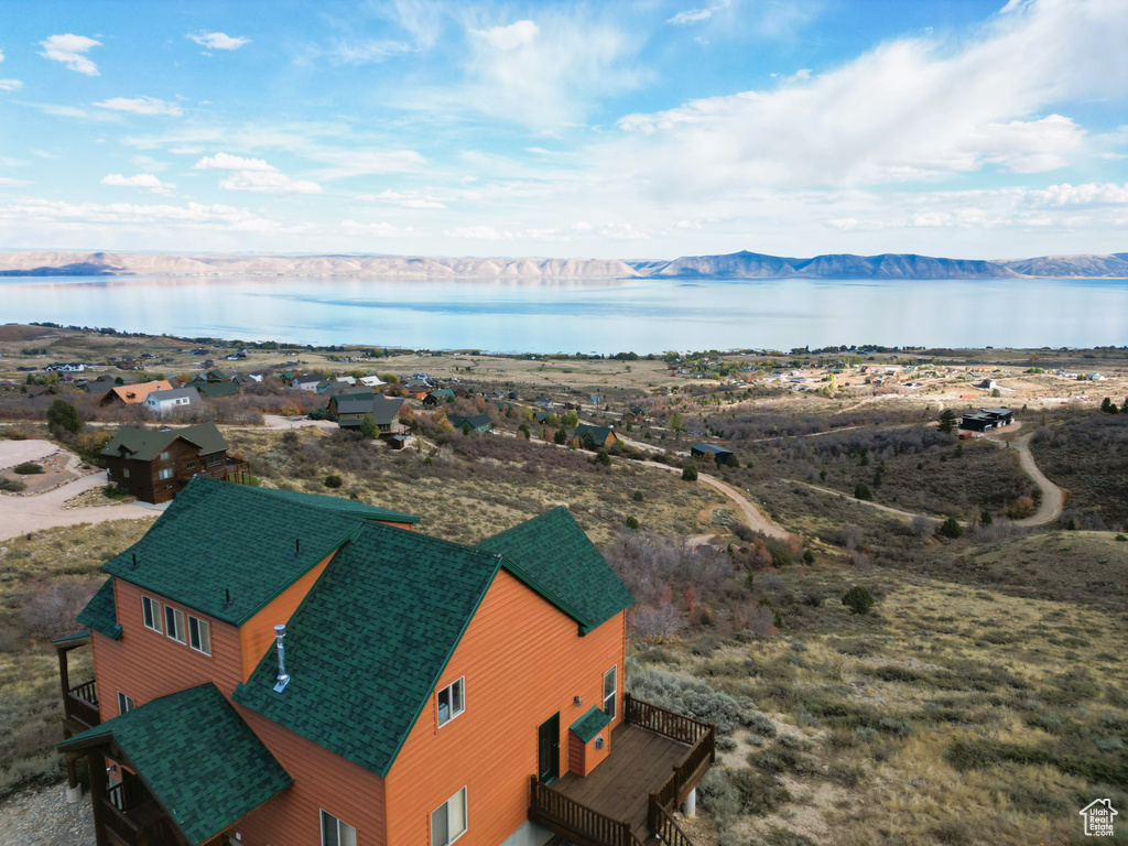 Drone / aerial view with a water and mountain view