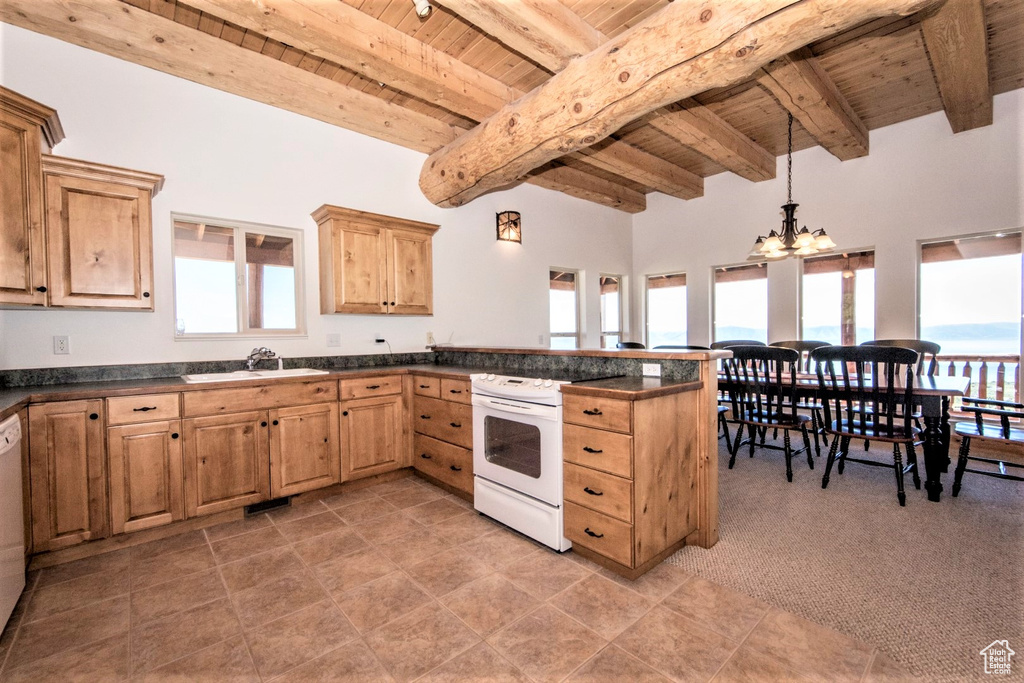 Kitchen with wood ceiling, beam ceiling, and white appliances