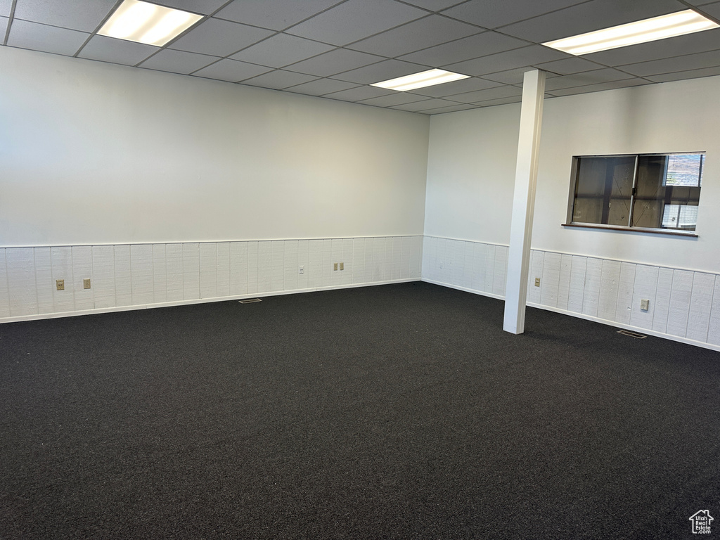 Carpeted empty room with a paneled ceiling