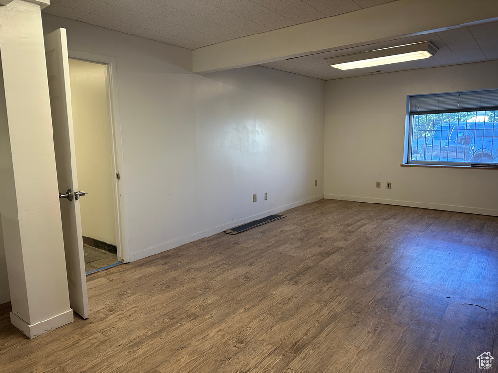 Spare room with wood-type flooring