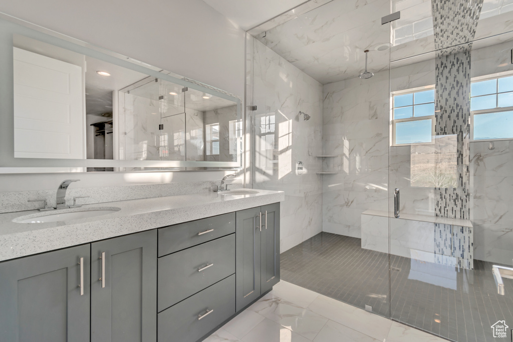 Bathroom featuring vanity and an enclosed shower