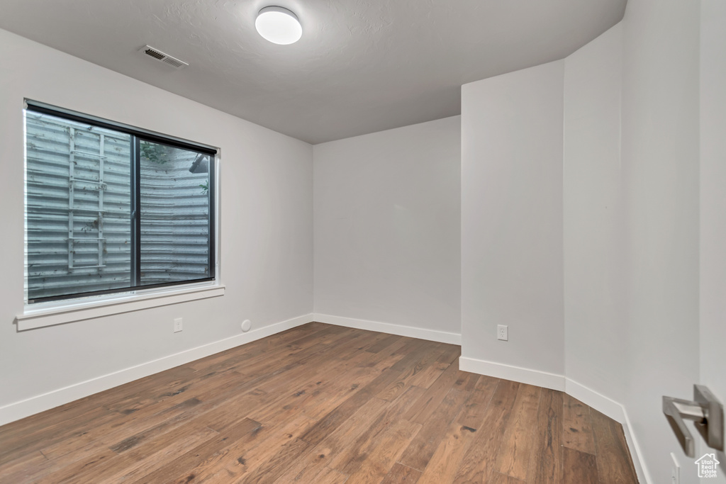 Unfurnished room with wood-type flooring