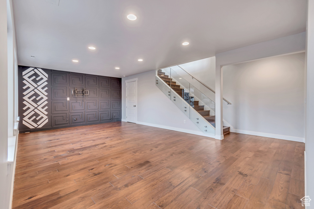 Unfurnished living room featuring hardwood / wood-style flooring