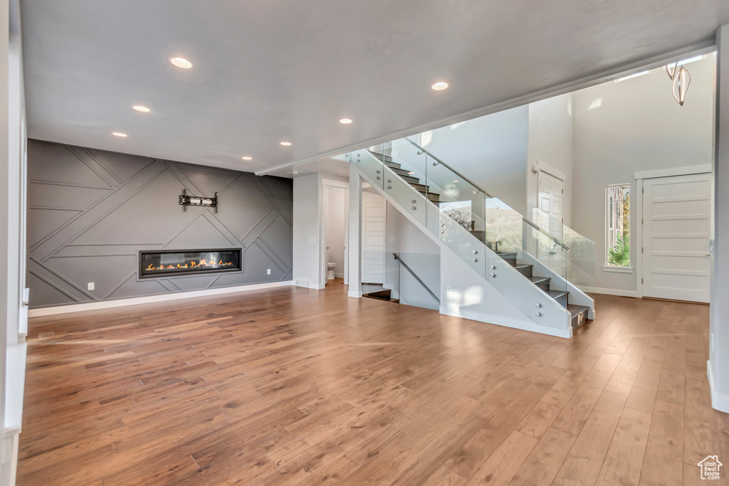 Unfurnished living room with hardwood / wood-style flooring