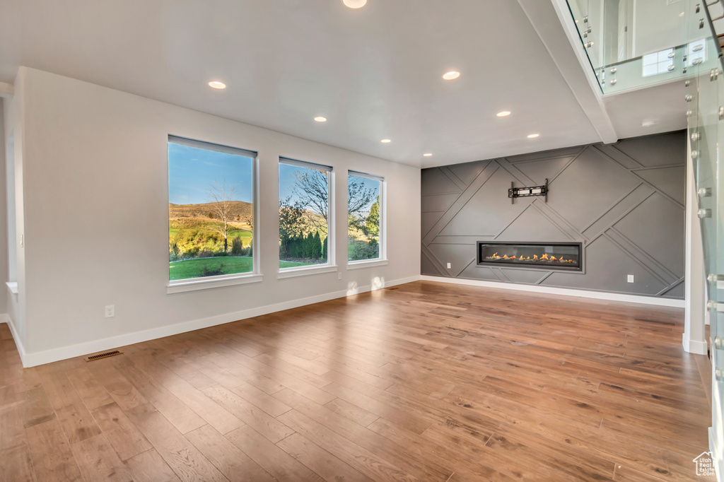 Unfurnished living room featuring light hardwood / wood-style floors