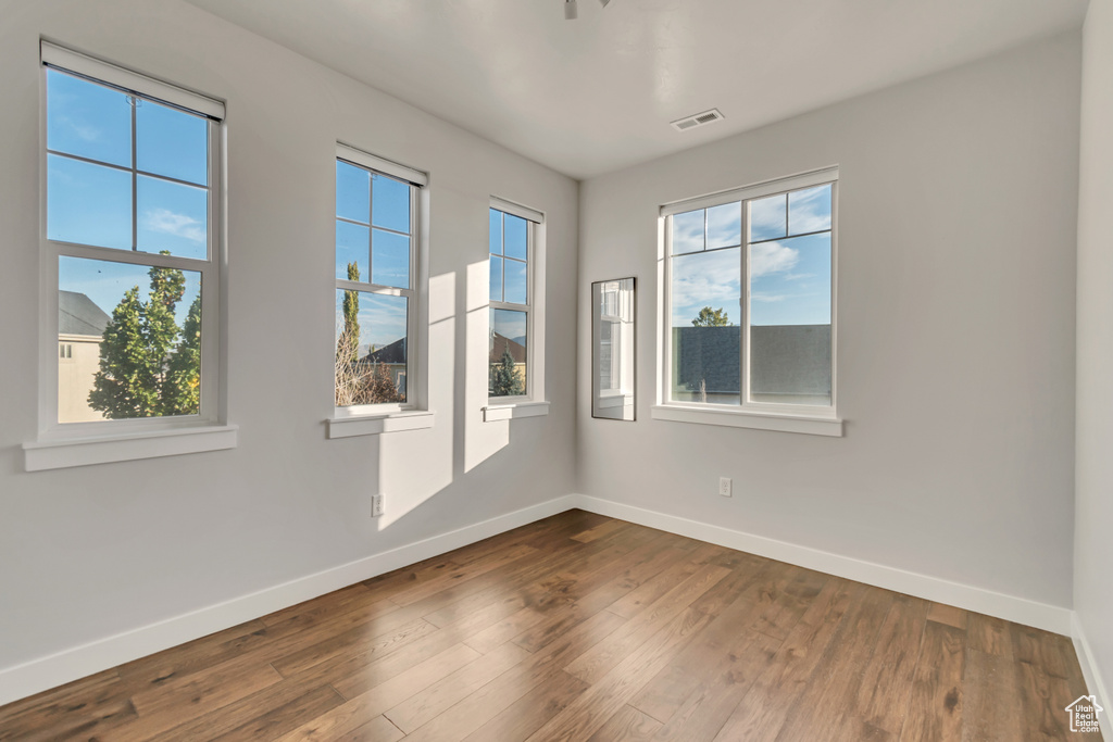 Spare room with hardwood / wood-style floors