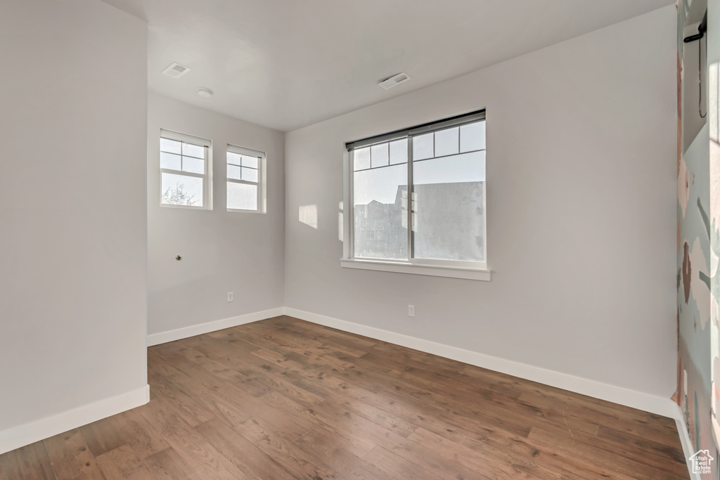 Unfurnished room featuring wood-type flooring