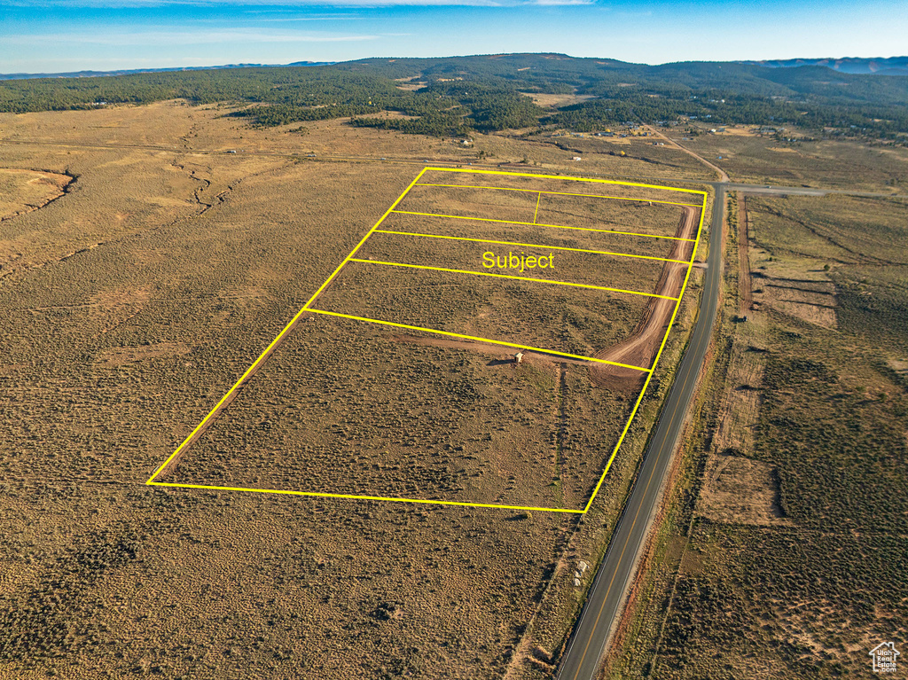 Birds eye view of property featuring a mountain view